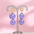 Detail of long pearl tassel earrings featuring lavender petals on a metal stand - Light Purple (A1383)
