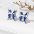 Silver butterfly stud earrings featuring blue zircon crystals and hollow design - Blue (A1559)