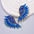 Blue crystal angel wing earrings with gold-tone base on a white circular display - Sapphire Blue Wing Style (Style B, Sapphire Blue Rhinestone)