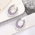 Detailed view of U-shaped silver earrings with purple rhinestones and white pearls - Silver Base + Purple Rhinestone