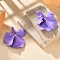 Detailed view of matte purple petal earrings featuring 3D floral textures and gold rings - Purple