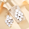 Detail of white matte layered flower petal tassel earrings on a natural stone base - White (A1599)