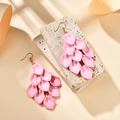 Detail of pink layered petal tassel earrings with matte finish on a stone texture - Pink (A1598)