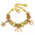 Gold snake chain bracelet with green glass beads and feather pendants for women - Style 009