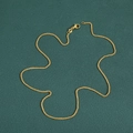 Polished 14K gold-plated wheat chain necklace with lobster clasp on dark background - Gold