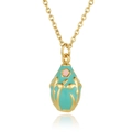 Macro view of mint green enamel egg pendant with gold floral patterns and pink flower - Sky Blue