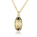 Macro detail of gold egg pendant with black enamel patterns and sparkling crystals - Black