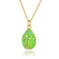 Detailed view of green enamel egg pendant with gold floral patterns and wave chain - Green Enamel Egg (D948) / Green