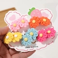 Detailed view of colorful sunflower hair ties on a cloud-shaped cardboard display card - Multicolor Set