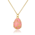 Macro detail of Russian egg pendant with pink enamel and gold filigree on a fine chain - Pink