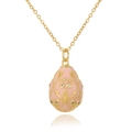 Detailed close-up of Russian egg pendant in pink enamel with gold-plated filigree patterns - Lotus Pink