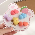 Detailed view of 5 pairs of colorful matte heart-shaped elastic hair ties for girls - Colorful