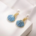 Elegant gold shell earrings with blue enamel finish and white pearl accents on display - Blue Shell Style (A929)