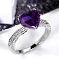 Elegant silver ring featuring a large purple heart-shaped stone and side accents - Purple