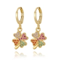 Macro shot of gold four-leaf clover earrings with colorful zircon stones in a detailed view - Clover Style (E1063-4)