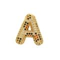 Macro shot of gold-plated letter A pendant with colorful pavé cubic zirconia stones - Letter A
