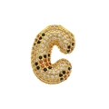 Macro detail of gold letter C balloon pendant with pave leopard pattern zircons - Letter C