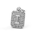Macro detail of silver-colored square pendant with letter I and zircon stones - Letter I