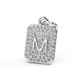 Detailed macro view of silver square pendant with letter M and pavé cubic zirconia stones - Letter M