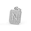 Detailed macro view of a silver square pendant featuring a cubic zirconia letter N design - Letter N