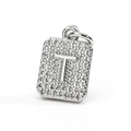 Macro shot of silver-plated rectangular letter T pendant with pavé set zircon stones - Letter T