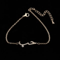 Rose gold chain bracelet with Arabic Love charm and sparkling zircon stones on black background - Bracelet-Rose Gold