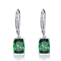 Detailed close-up of emerald green rectangular leverback earrings with silver prongs - Green
