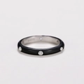 Macro detail of black matte band ring featuring inlaid white zircons and S925 hallmark - Black