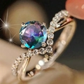 Macro detail of V-shaped zircon ring featuring a multicolor gradient gemstone in rose gold - US 5 / Colorful