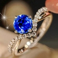 Macro shot of V-shaped silver ring with royal blue zircon and sparkling crystal accents - US 5 / Blue
