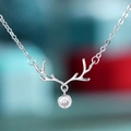 Elegant silver reindeer antler pendant necklace with a round clear gemstone for women - White Gold