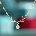 Elegant gold reindeer antler necklace with sparkling zircon pendant on O-chain - Gold