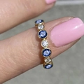 Gold ring with blue and white zircons worn on finger for a stylish daily look - US 7 / Gold + Blue Zirconia