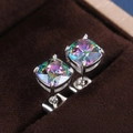 Macro view of square cut rainbow gemstone stud earrings with silver four-prong setting - Colorful