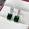 Detail of emerald cut green zircon drop earrings with pave stones on silver hoops - Green