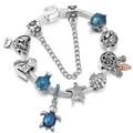 Silver ocean themed charm bracelet with blue glass beads, starfish and turtle dangles - Blue Marine Life Style (Style 007)
