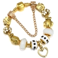 Elegant gold-plated beaded charm bracelet with heart pendant and white floral accents - 16cm / Gold Paris Travel Theme Style (002)