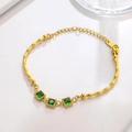 Detail of gold bamboo chain bracelet featuring three emerald green square gemstones - Bamboo Link Square Green Gem Gold