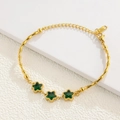 Detail of gold bamboo link bracelet featuring three star-shaped emerald green crystals - Bamboo Link Star Green Gem Gold