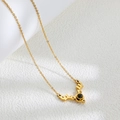 Elegant gold titanium steel necklace featuring a sparkling antler pendant with a central dark stone - Gold