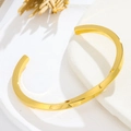 Bracelet ouvert spirale minimaliste en acier titane or rose pour femme avec fini poli - Or Homme