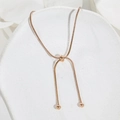 Detailed view of adjustable rose gold snake chain bracelet with slider bead and polished finish - B139 Adjustable Anklet / Rose Gold
