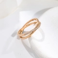 Close-up of rose gold crisscross ring with micro-pave white cubic zirconia stones - US 5 / Rose Gold