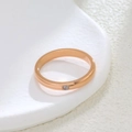 Minimalist rose gold titanium steel ring with a single small sparkling zircon stone - US 5 / Rose Gold