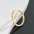 Minimalist gold titanium steel thin ring with a single small sparkling zircon stone - US 5 / Rose Gold