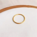 Minimalist gold band ring with tiny gemstone inlay on a clean white tray - US 5 / Gold