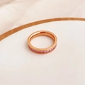 Macro detail of rose gold band featuring pink princess-cut zircon stones in a row - US 5 / Rose Gold (Pink Rhinestone)