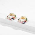 Detailed close-up of retro enamel floral hoop earrings with colorful hand-painted flowers - Green