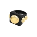 Macro detail of Y2K black resin ring featuring polished golden spheres and geometric design - Black