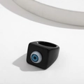 Detailed close-up of a chunky black resin ring featuring a realistic blue eye centerpiece - Fixed Size / Black